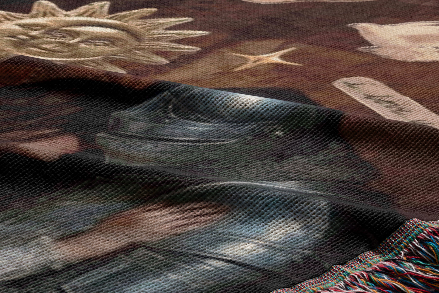 The image is a close-up of a fabric with a metallic texture, featuring a metallic object and a sun-like design.