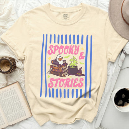 Cream t-shirt with "Spooky & Stories" graphic featuring books, ghost, cauldron and hat.