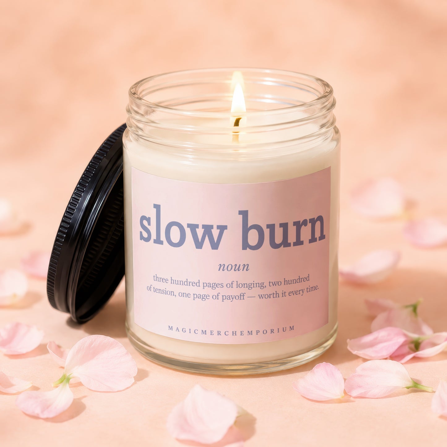 "Slow Burn" candle with a lit wick, glass jar, and text defining the term.