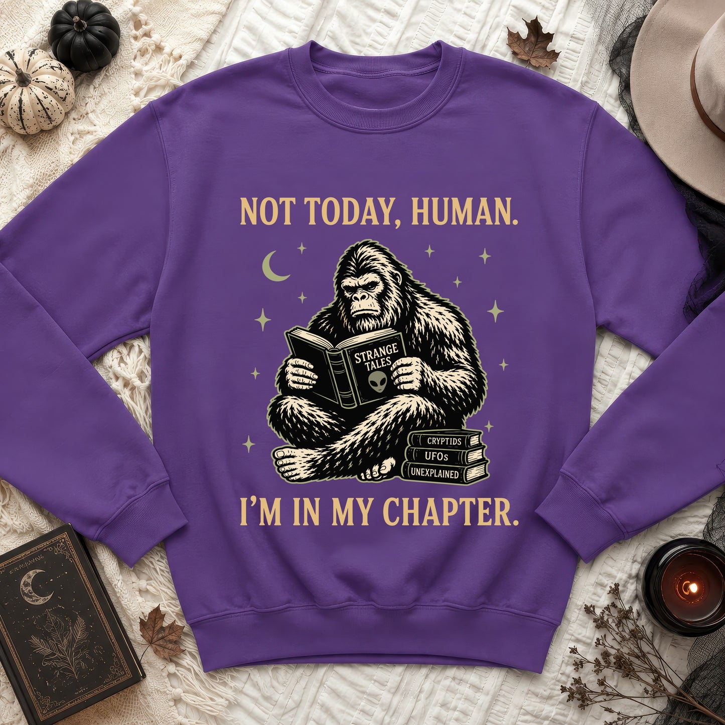 Purple sweatshirt with Bigfoot reading "Strange Tales" and text "Not today, human. I'm in my chapter."