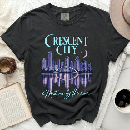 Black t-shirt with "Crescent City" text and a cityscape reflected in water.