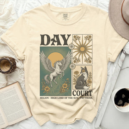 Cream t-shirt with "DAY COURT" graphic featuring pegasus, fox, sun, and compass.