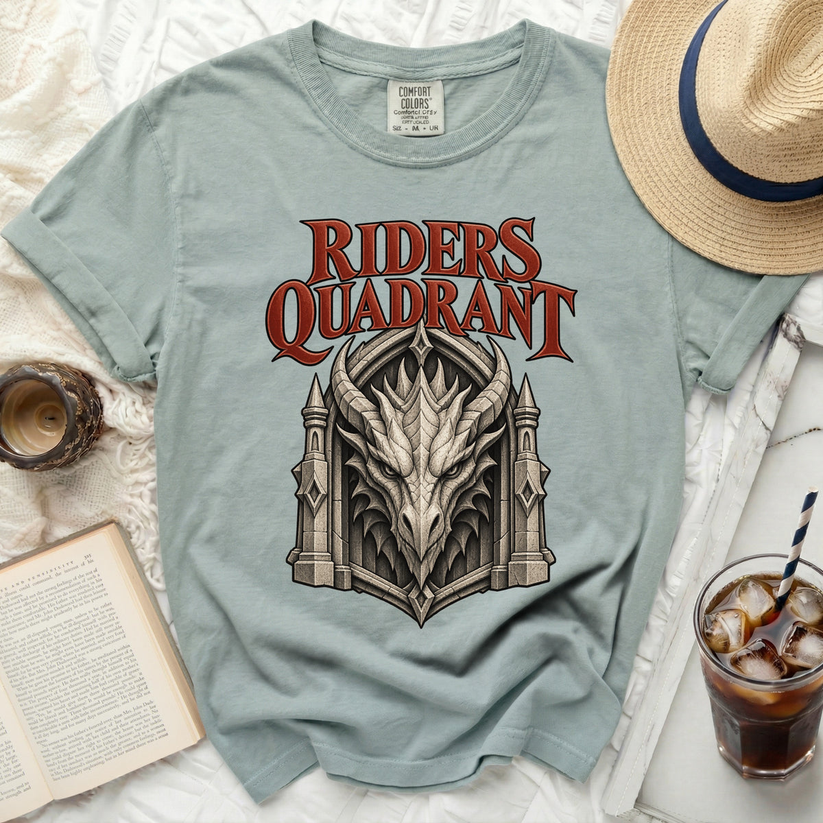 Light blue t-shirt with "Riders Quadrant" text and a dragon head graphic.