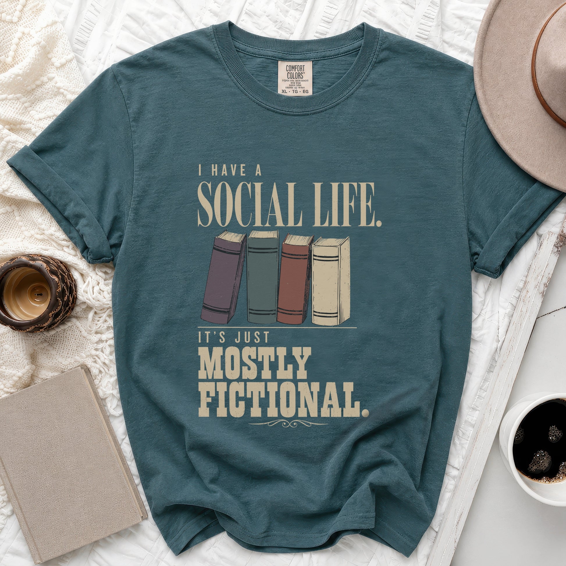 Teal t-shirt with "I have a social life. It's just mostly fictional" text.