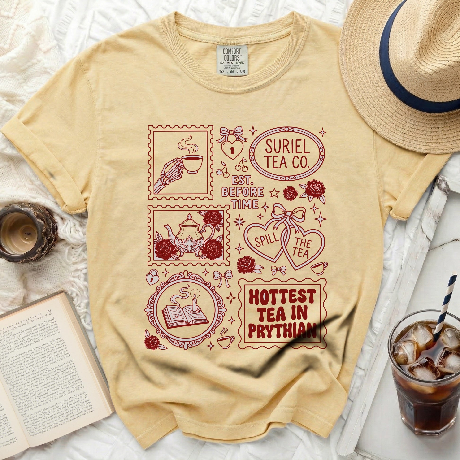 Yellow t-shirt with maroon stamp-like designs of tea-related icons and text.