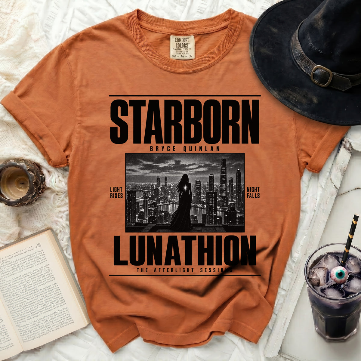 Orange t-shirt with "STARBORN BRYCE QUINLAN LUNATHION" text and city graphic.