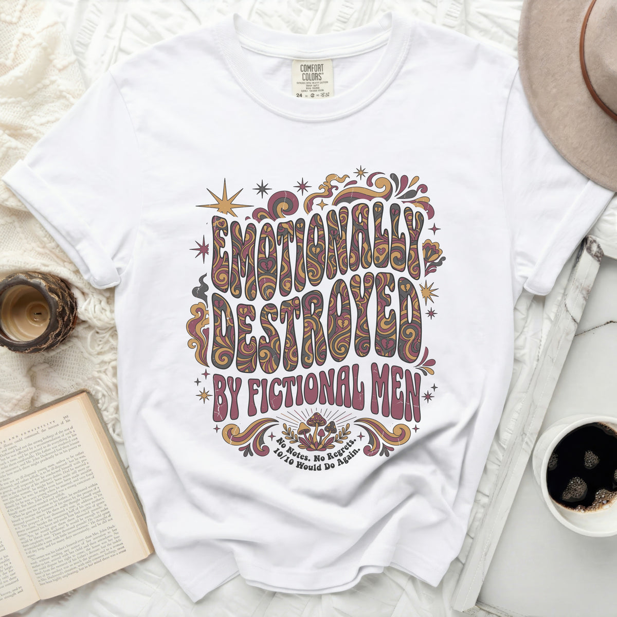 White t-shirt with "Emotionally Destroyed by Fictional Men" graphic.