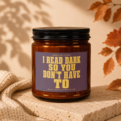 Amber candle with a label that says "Smells like I Read Dark So You Don't Have to".