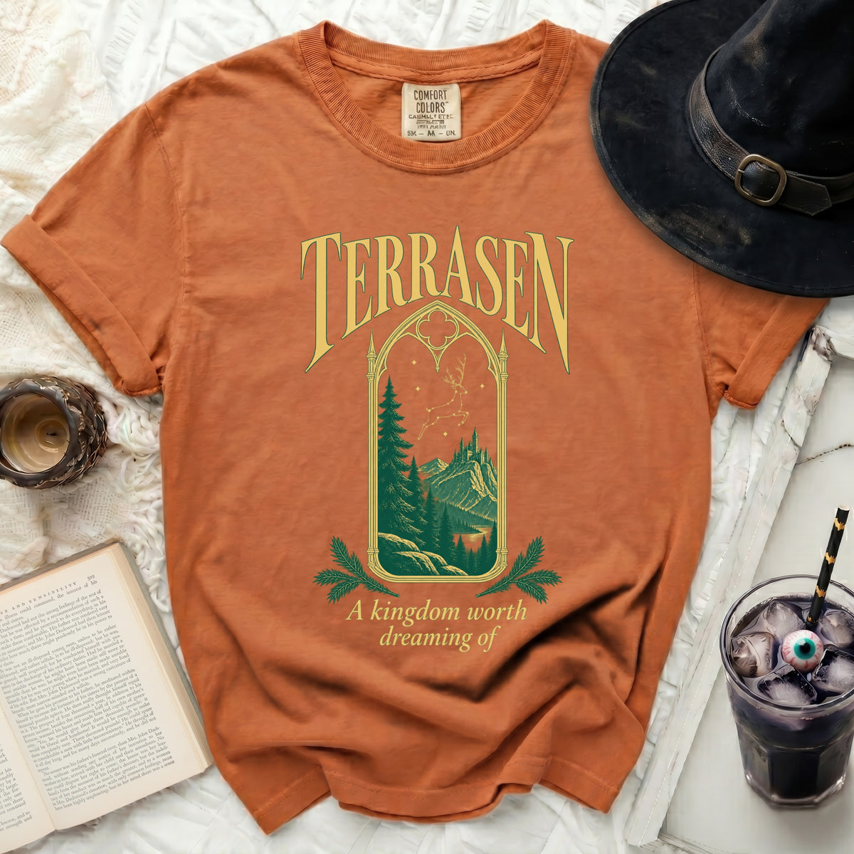 Orange t-shirt with "TERRASEN" and "A kingdom worth dreaming of" text.