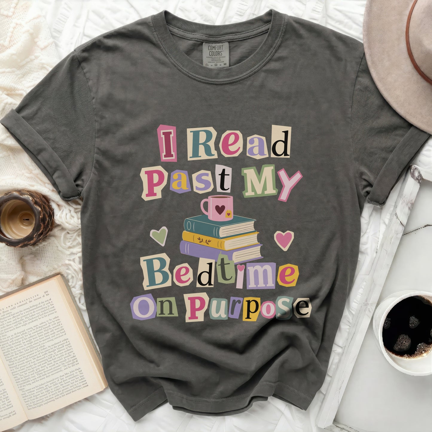 T-shirt with "I Read Past My Bedtime On Purpose" text and stack of books.