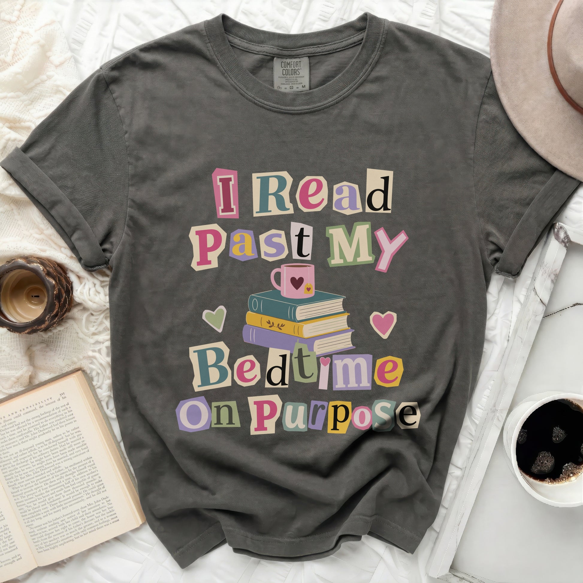 T-shirt with "I Read Past My Bedtime On Purpose" text and stack of books.