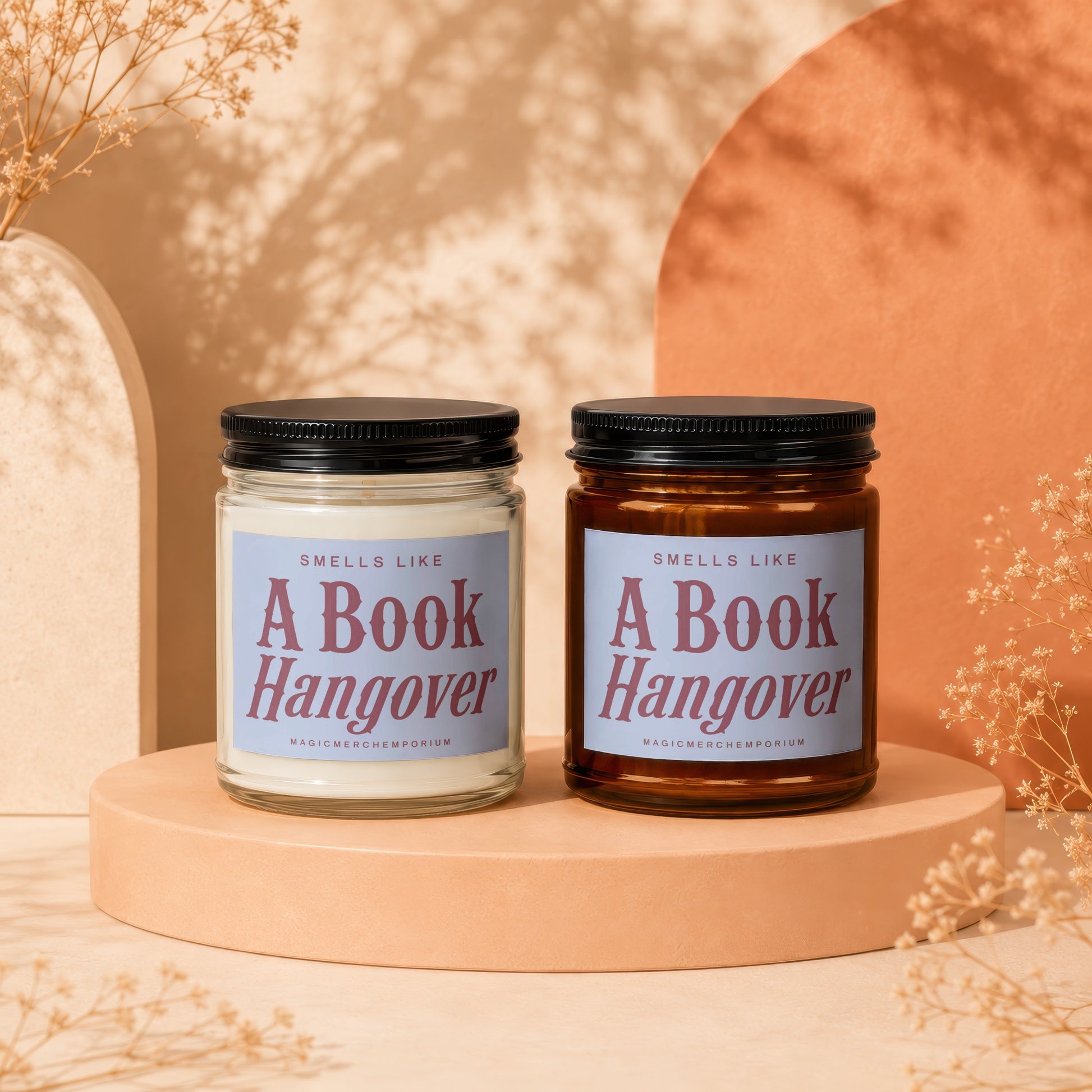 Two candles with "Smells Like A Book Hangover" text on labels.