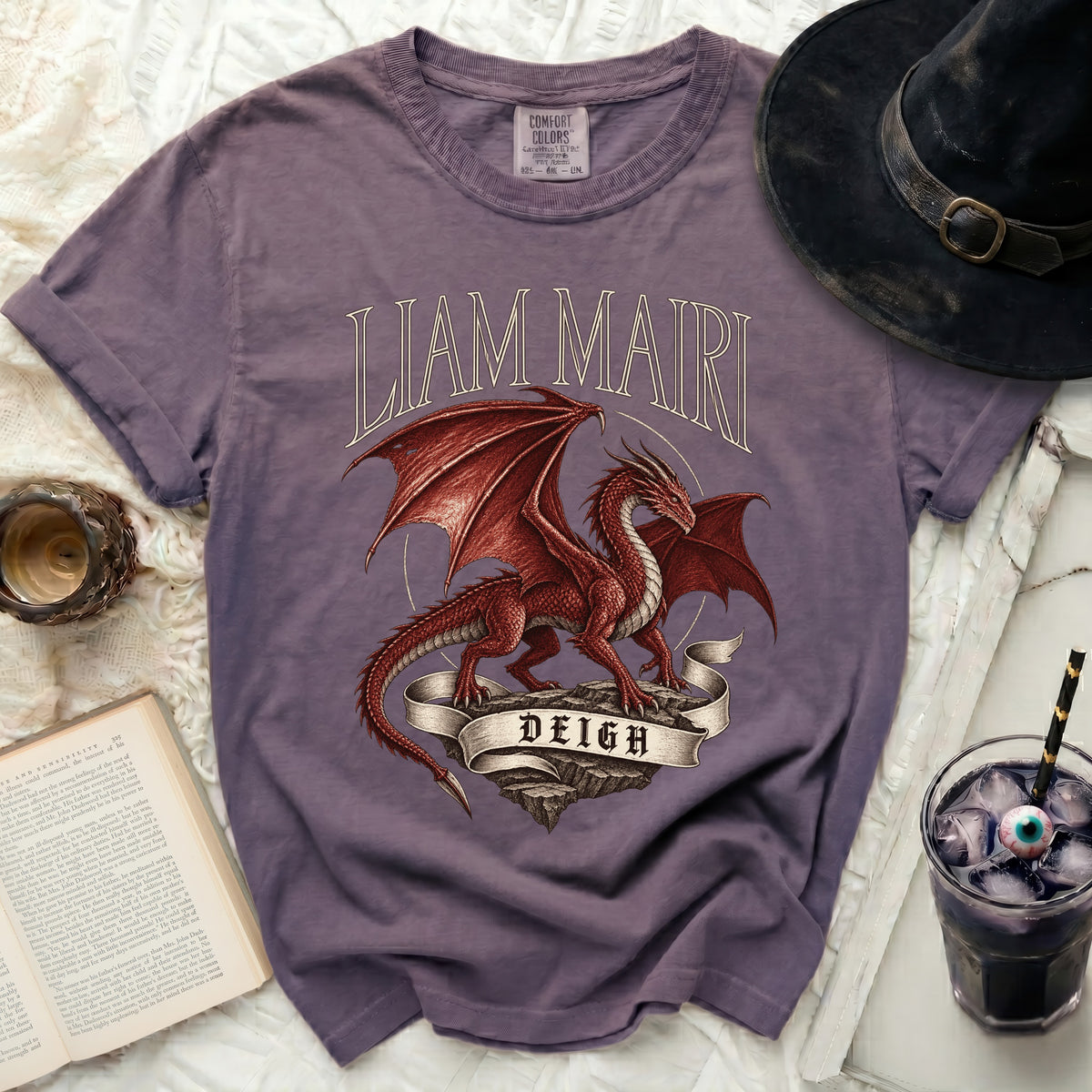 Purple t-shirt with red dragon graphic and text "LIAM MAIRI DEIGH"