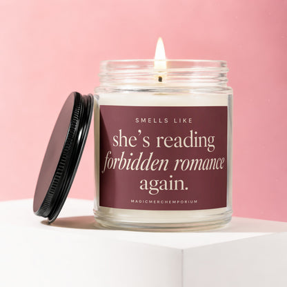 Scented candle with text "smells like she's reading forbidden romance again."