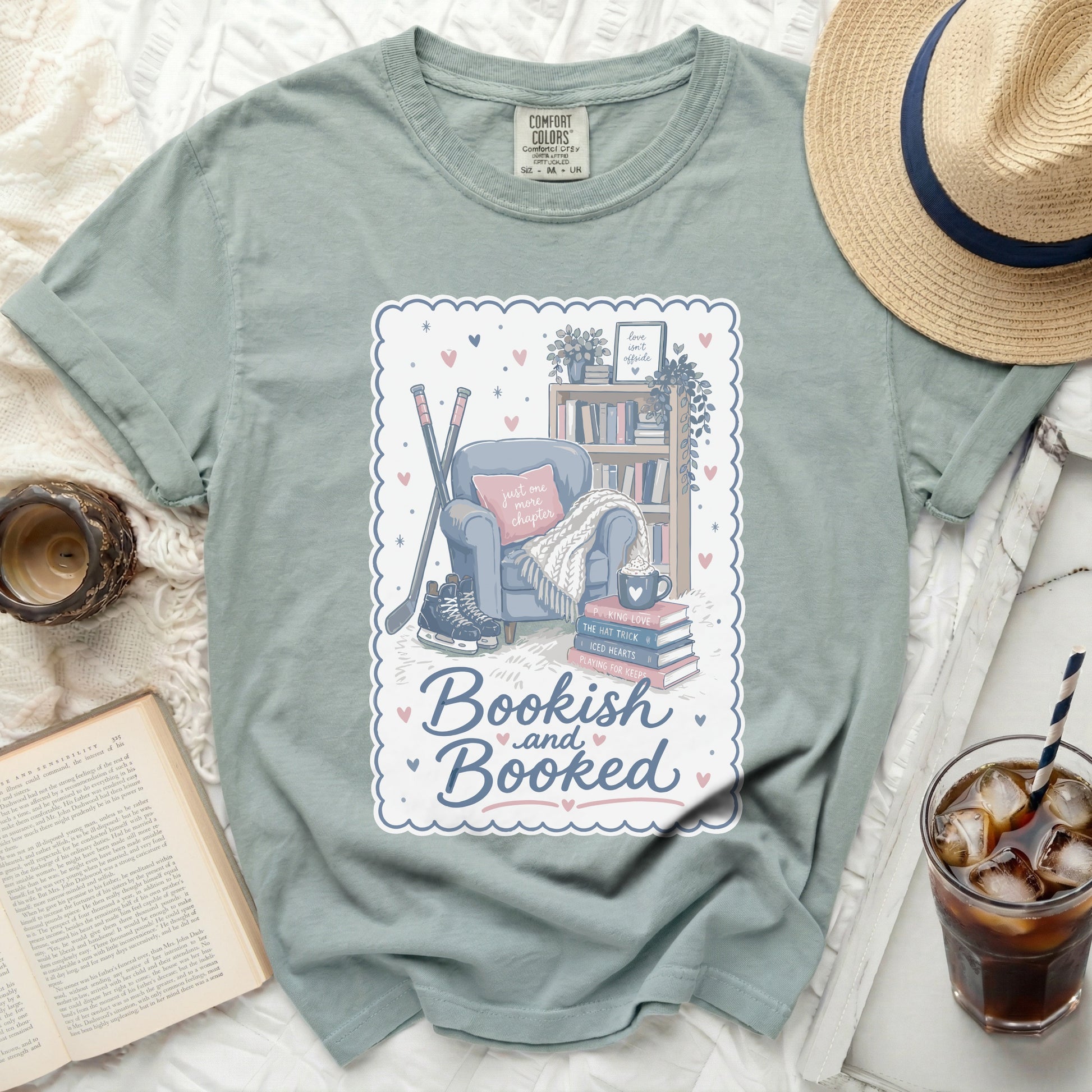 T-shirt with "Bookish and Booked" text and bookshelf illustration.