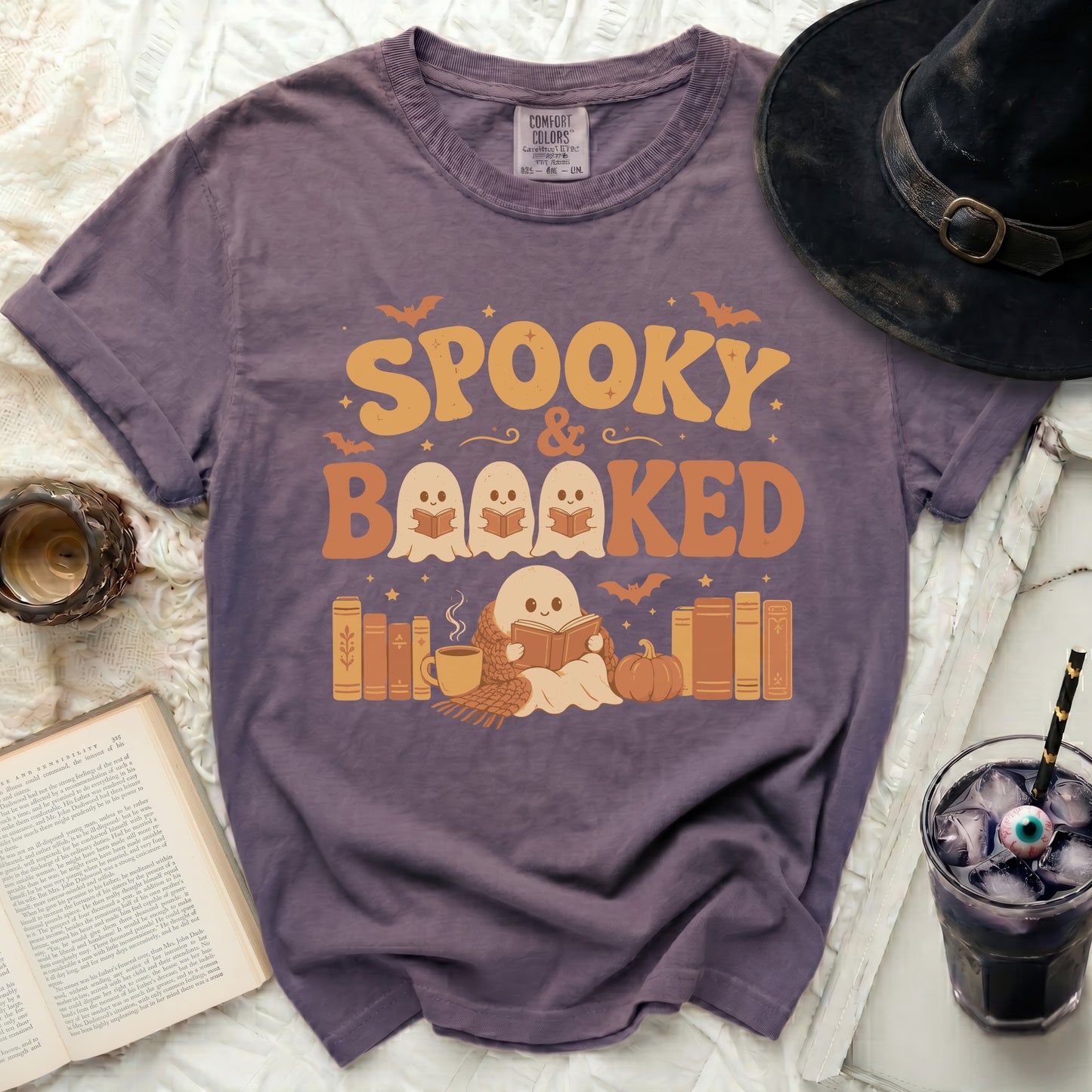 Spooky & Booked Halloween graphic t-shirt with ghosts reading books.
