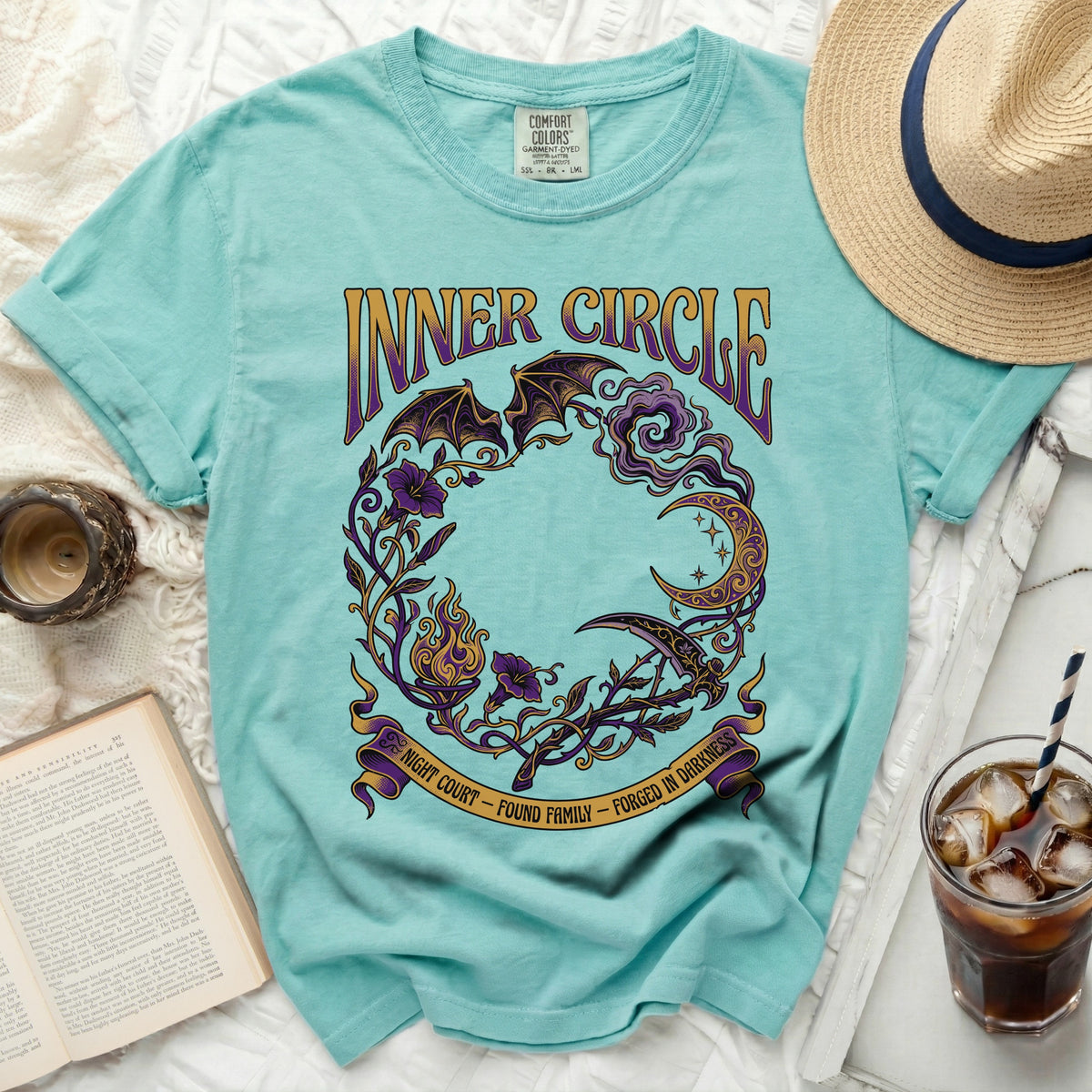 Aqua t-shirt with "Inner Circle" text and a dark fantasy circular design.