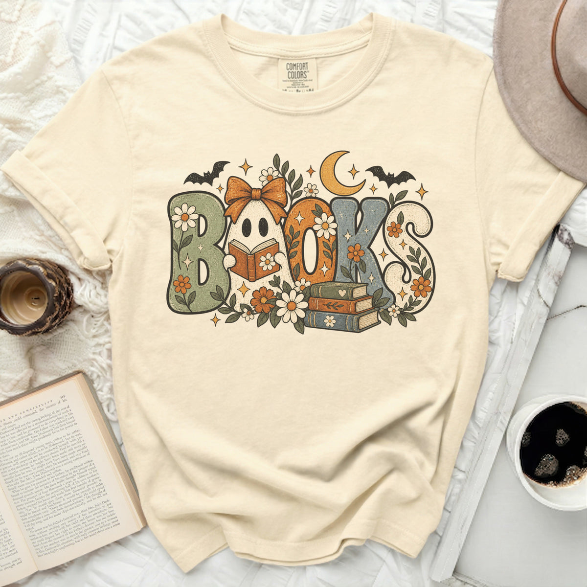 Cream t-shirt with "BOOKS" in retro font, ghost, bats, moon, and flowers.
