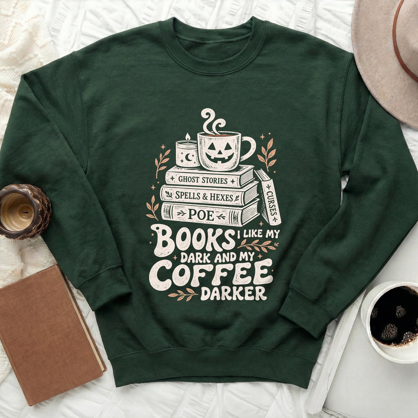 Green sweatshirt with stacked books, jack-o'-lantern mug, and candle, reading "Books I Like My Dark and My Coffee Darker".