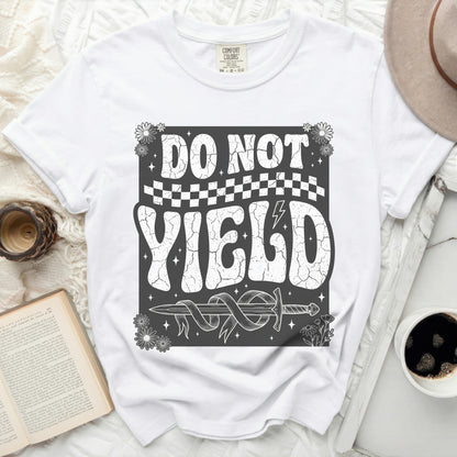 White t-shirt with "DO NOT YIELD" graphic and sword motif.