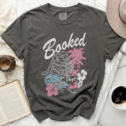 Dark gray t-shirt with "Booked for the Hockey Player" text and graphics.