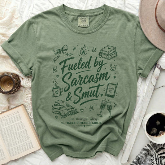 T-shirt with "Fueled by Sarcasm & Smut" and "Dark Romance Girlie" text.
