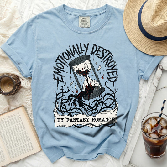 Light blue t-shirt with cracked hourglass and text "Emotionally Destroyed By Fantasy Romance".