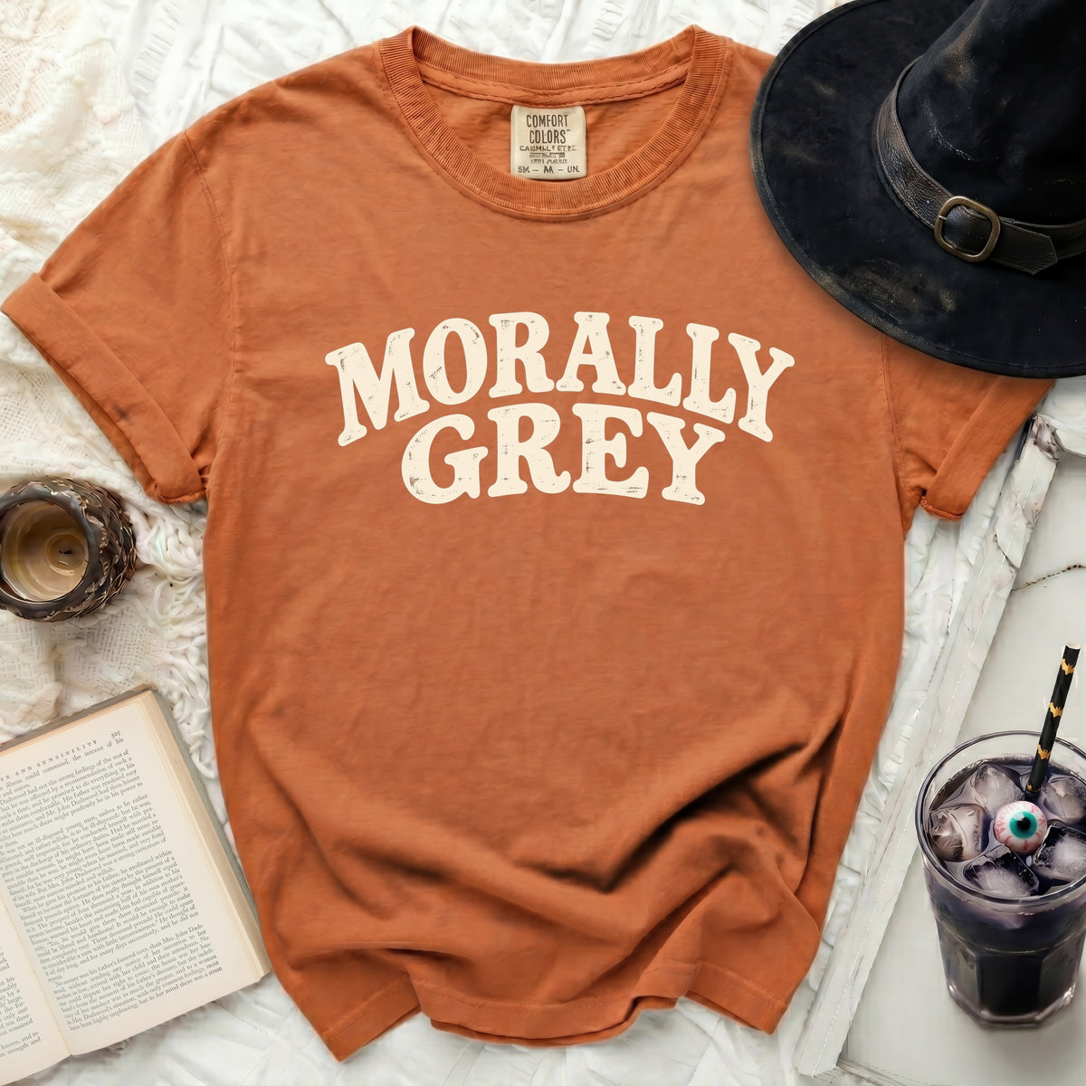 Orange t-shirt with "MORALLY GREY" in cream distressed lettering.