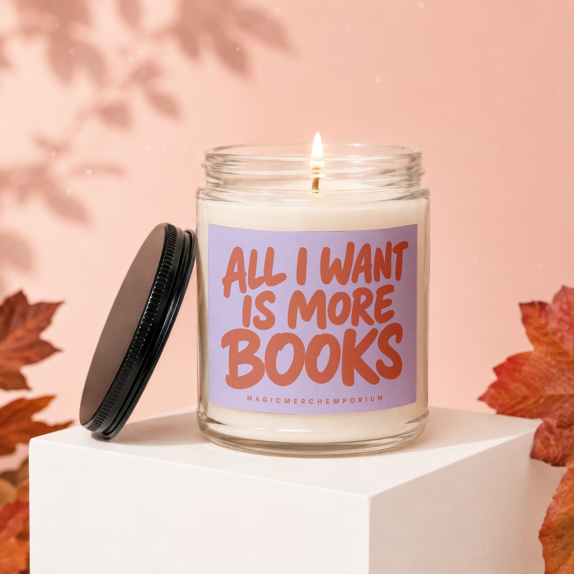 Candle with "All I Want Is More Books" text on a lavender label.