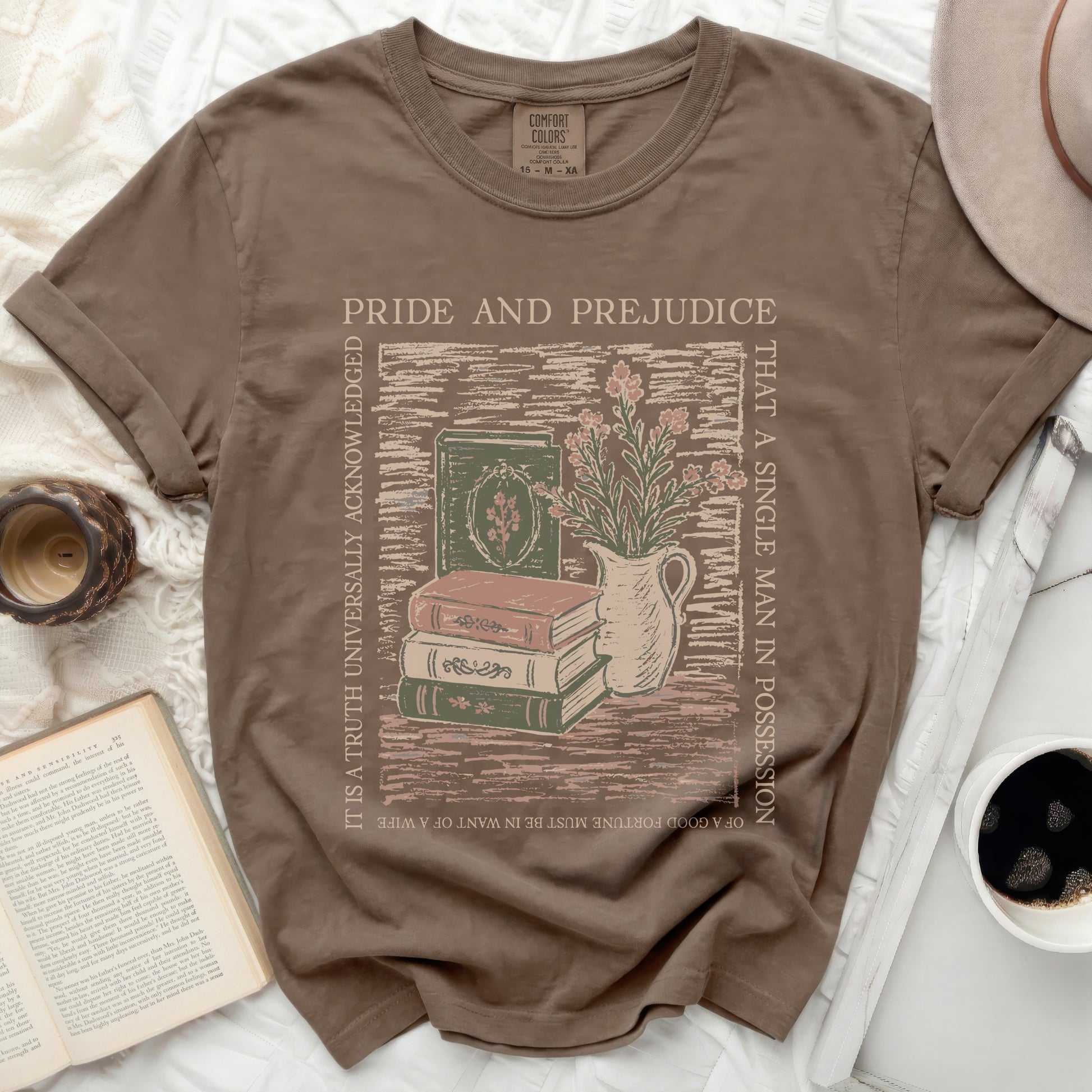 Brown t-shirt with Pride and Prejudice graphic of books and flowers.