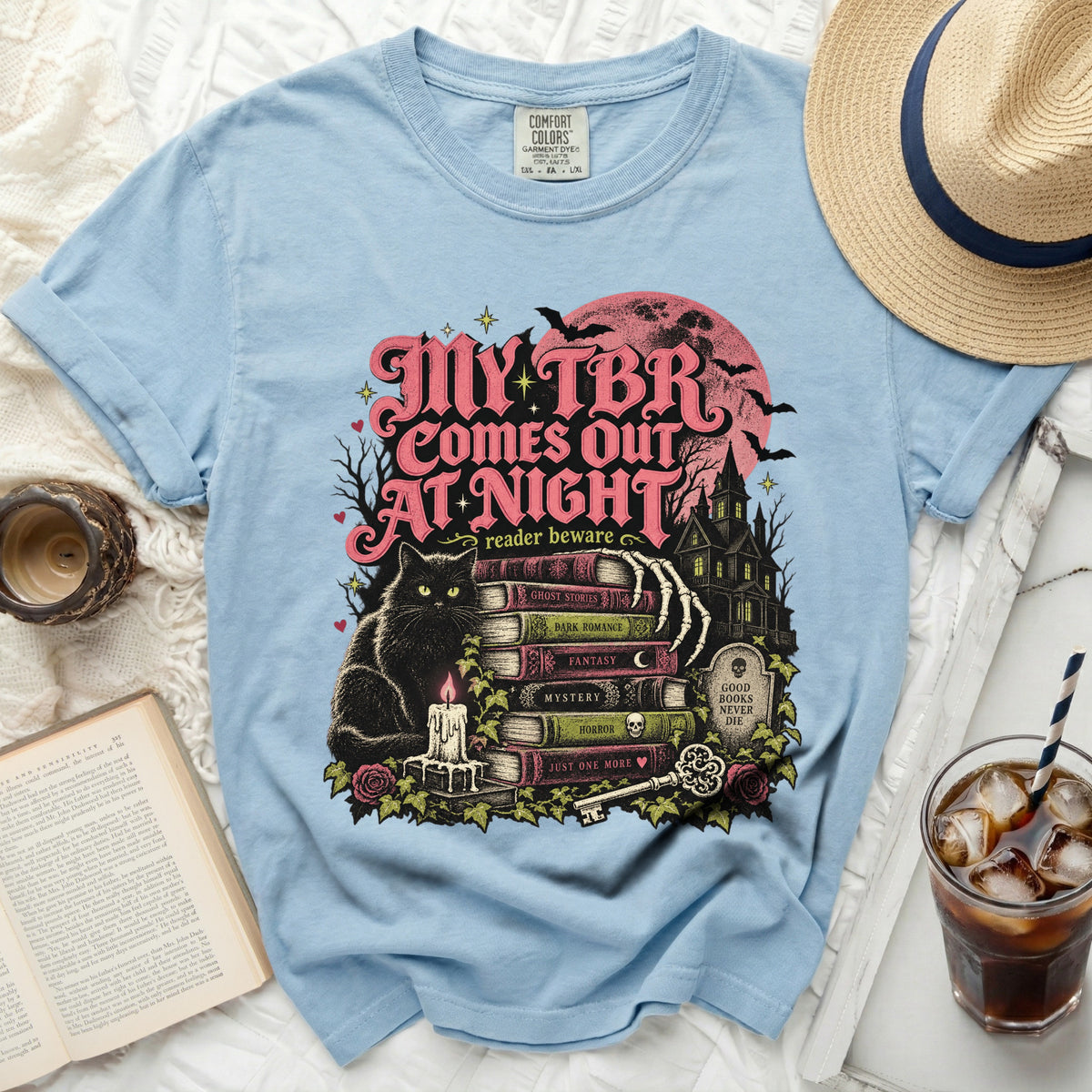 Light blue t-shirt with "My TBR Comes Out At Night" graphic featuring a black cat and books.