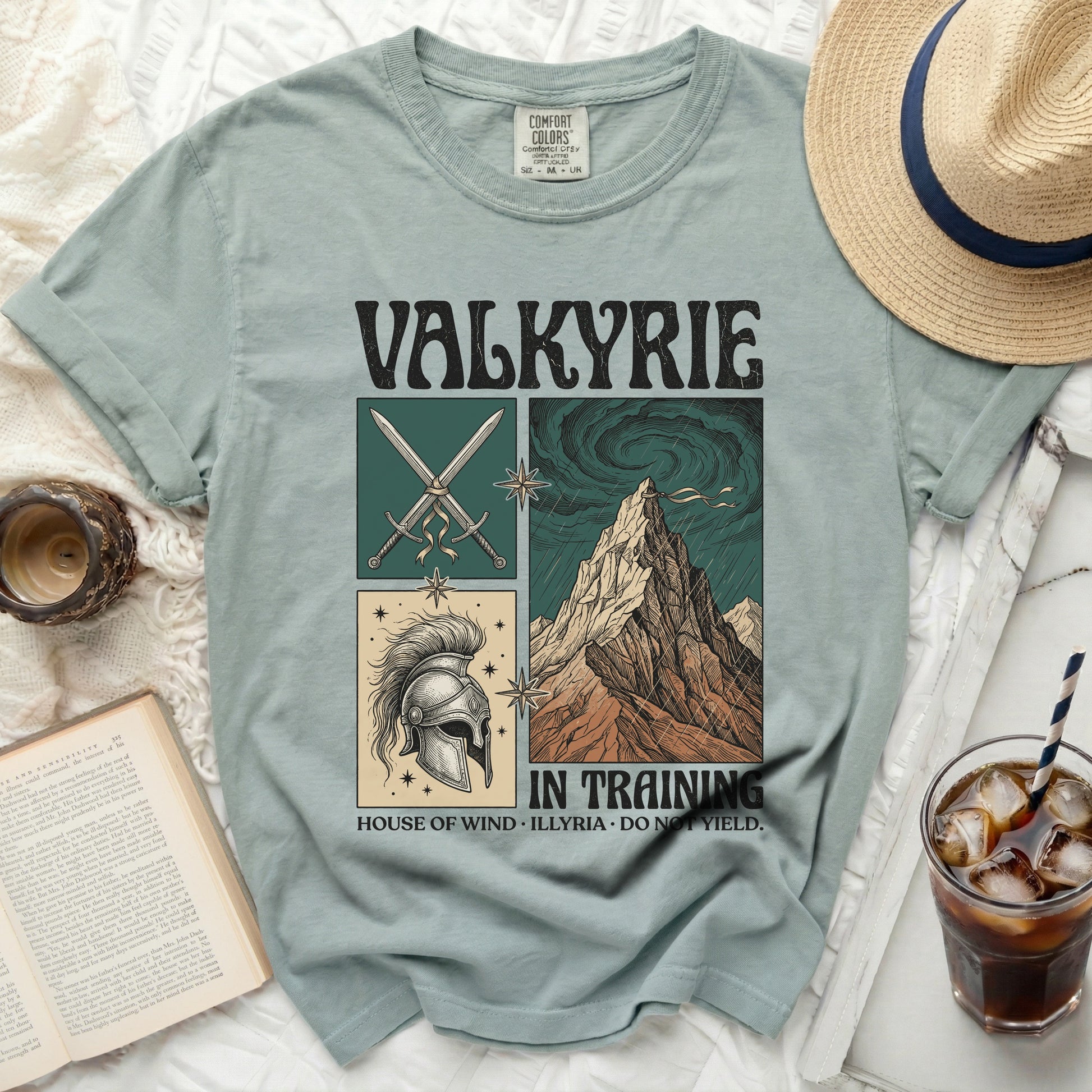 Valkyrie t-shirt with sword, helmet, and mountain graphics and text.