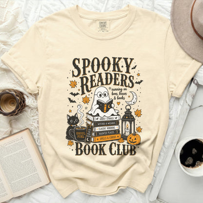 Spooky Readers Book Club graphic with ghost reading on books, cat and pumpkin.