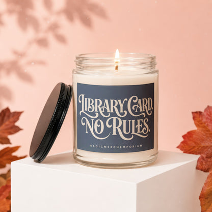 Candle with "Library Card No Rules" text and "MagicMerchEmporium" brand.