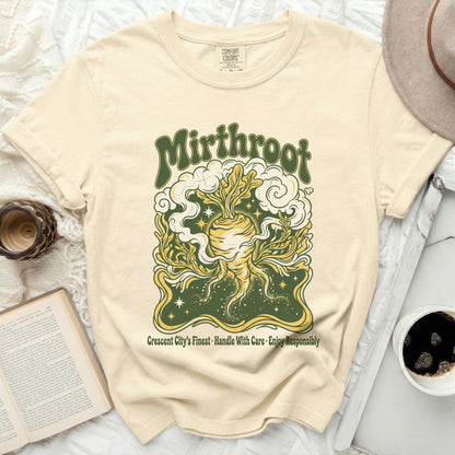 Cream t-shirt with "Mirthroot" and root vegetable design.