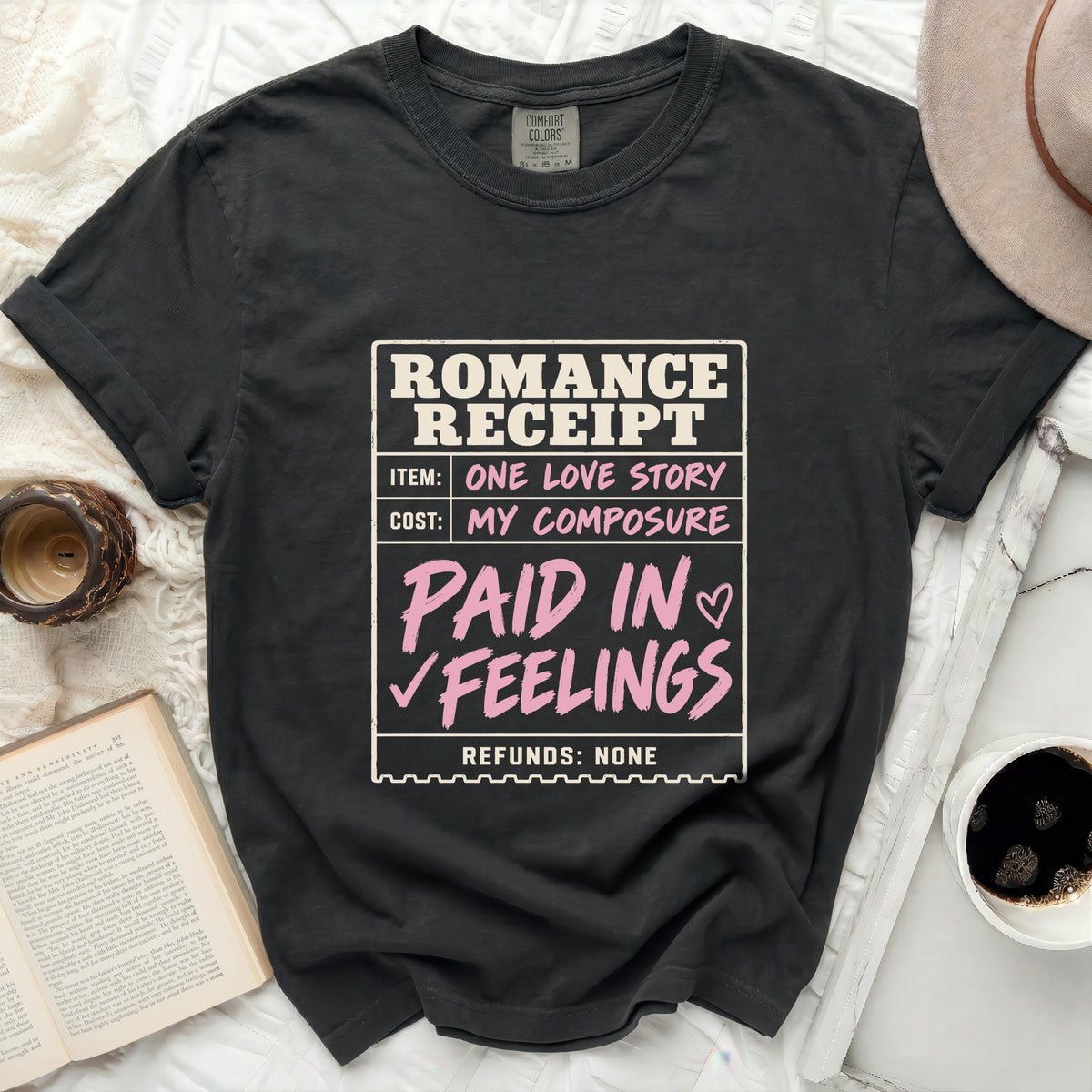 Black t-shirt with "Romance Receipt" graphic: Item one love story, cost my composure, paid in feelings, refunds none.