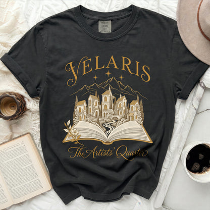 Black Comfort Colors t-shirt with "Velaris The Artists Quarter" text and building graphic.