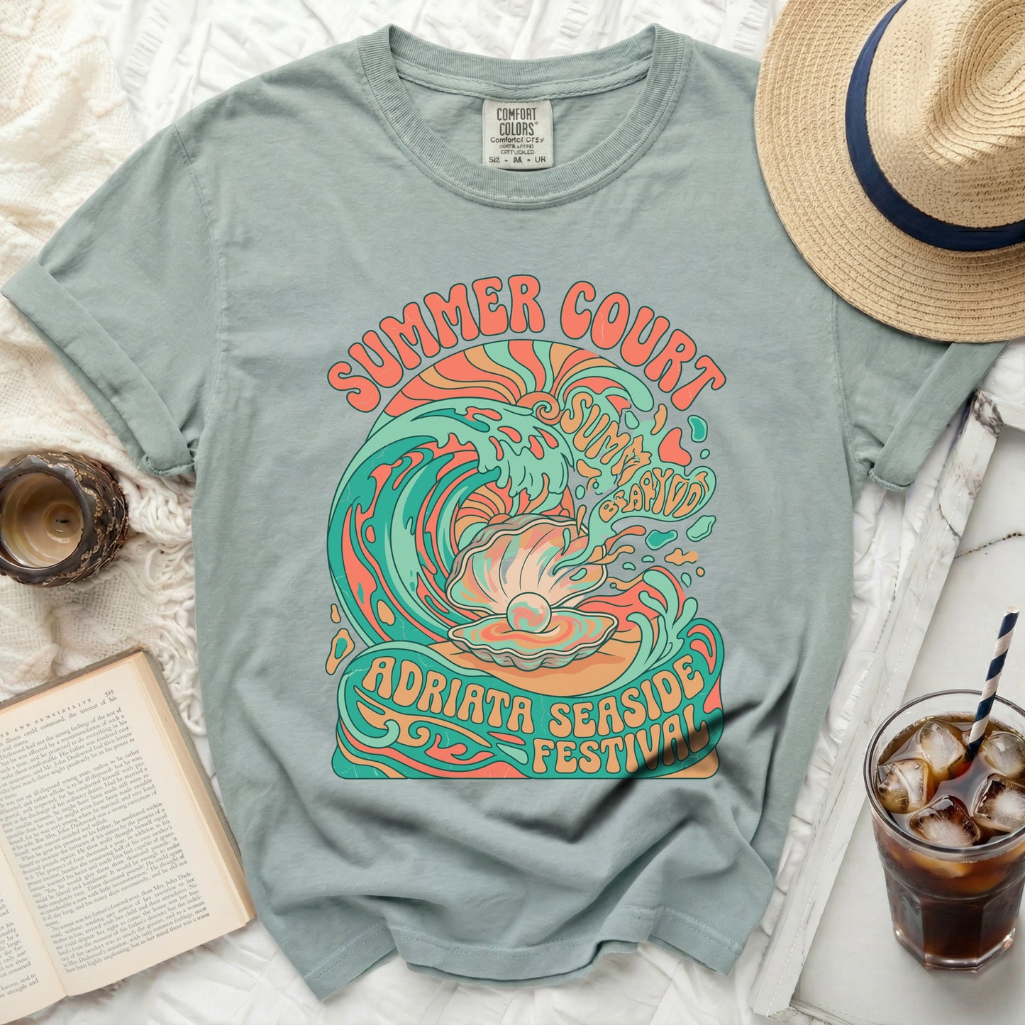Green t-shirt with "Summer Court Adriata Seaside Festival" text and a seashell wave graphic.