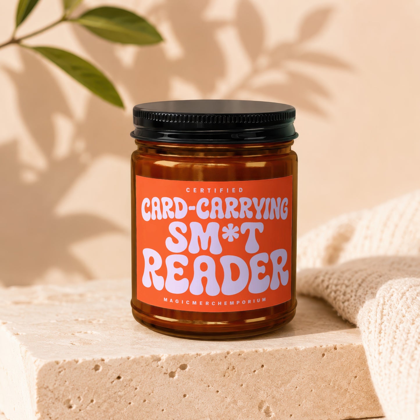 Amber jar with orange label that reads "Certified Card-Carrying S*** Reader".
