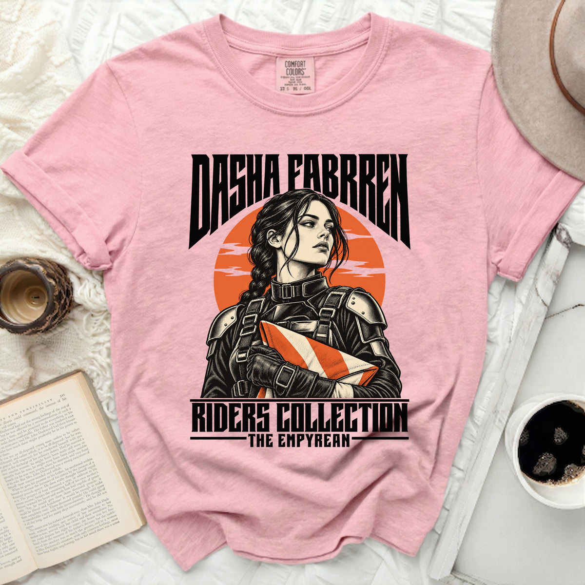 Pink t-shirt with "Dasha Fabrren Riders Collection - The Empyrean" text and illustration.