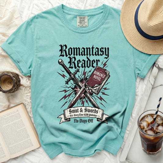 Romantasy Reader t-shirt with sword, skull, and romance novel graphic.