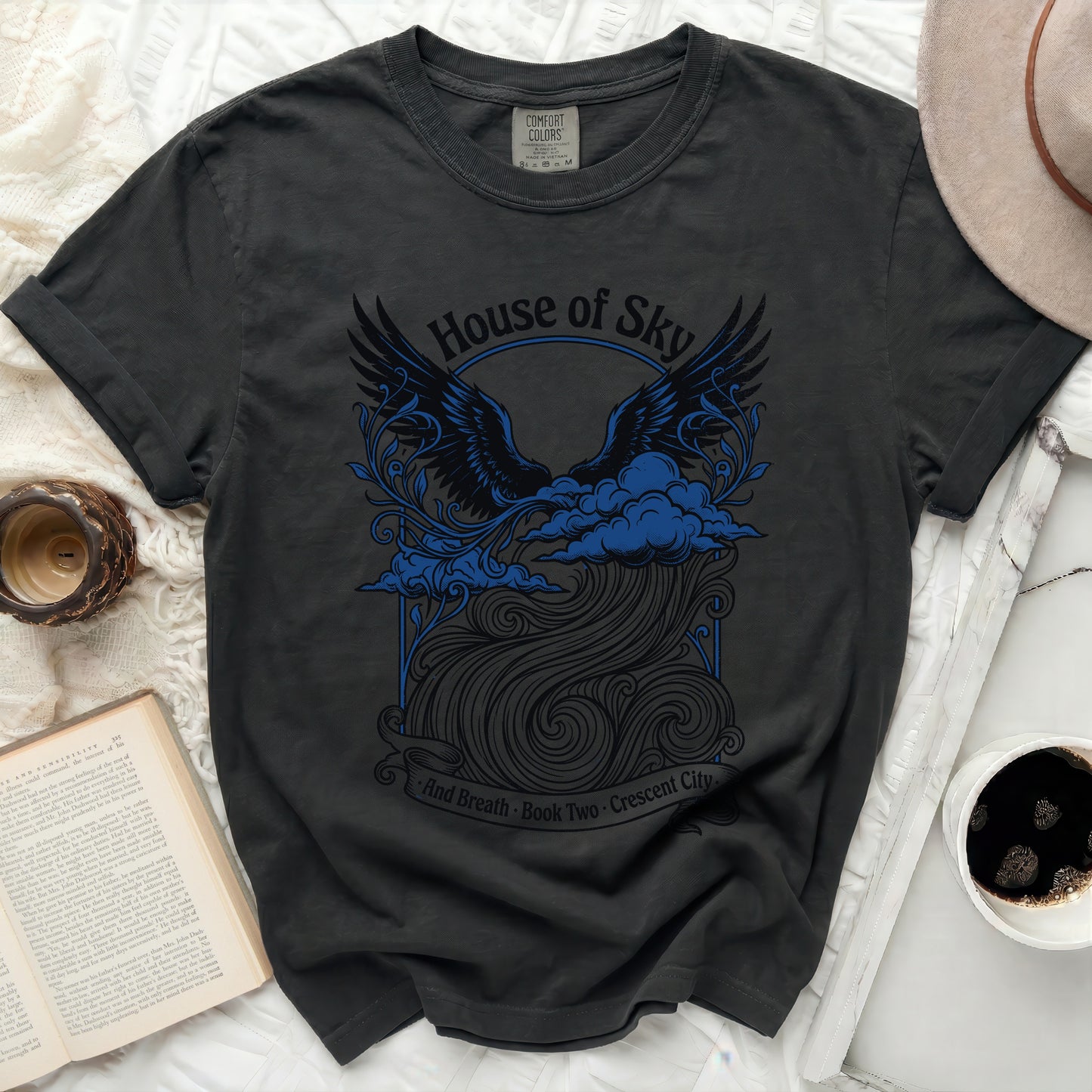 Black t-shirt with "House of Sky and Breath Book Two Crescent City" text and winged design.