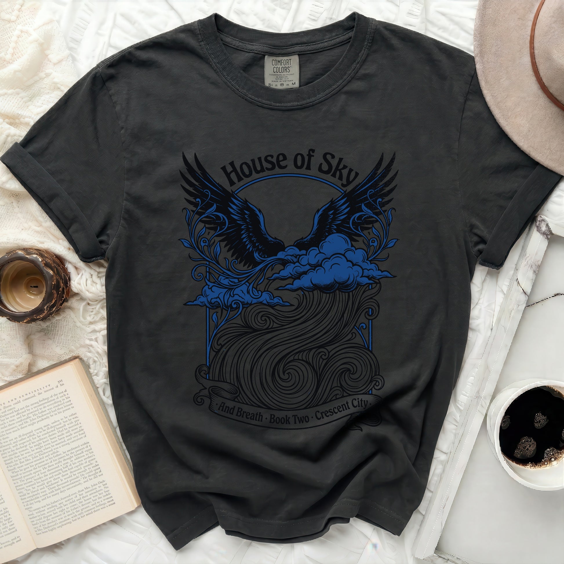 Black t-shirt with "House of Sky and Breath Book Two Crescent City" text and winged design.