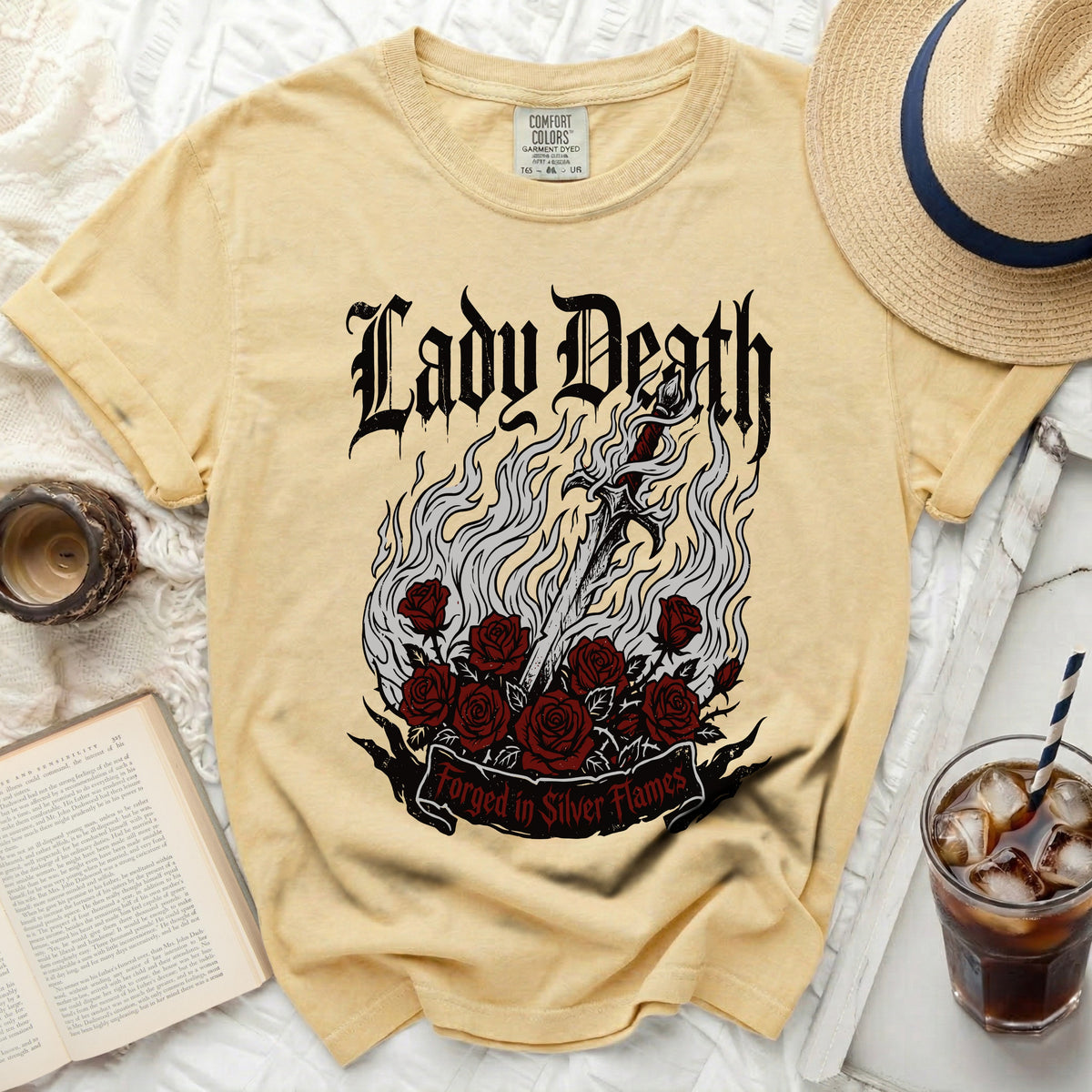 Yellow t-shirt with "Lady Death" and "Forged in Silver Flames" graphic.