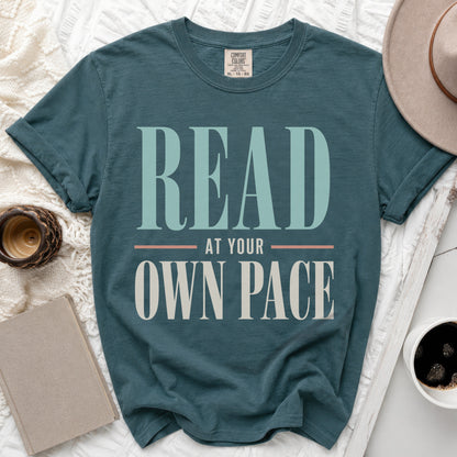Teal t-shirt with "READ AT YOUR OWN PACE" text and Comfort Colors tag.