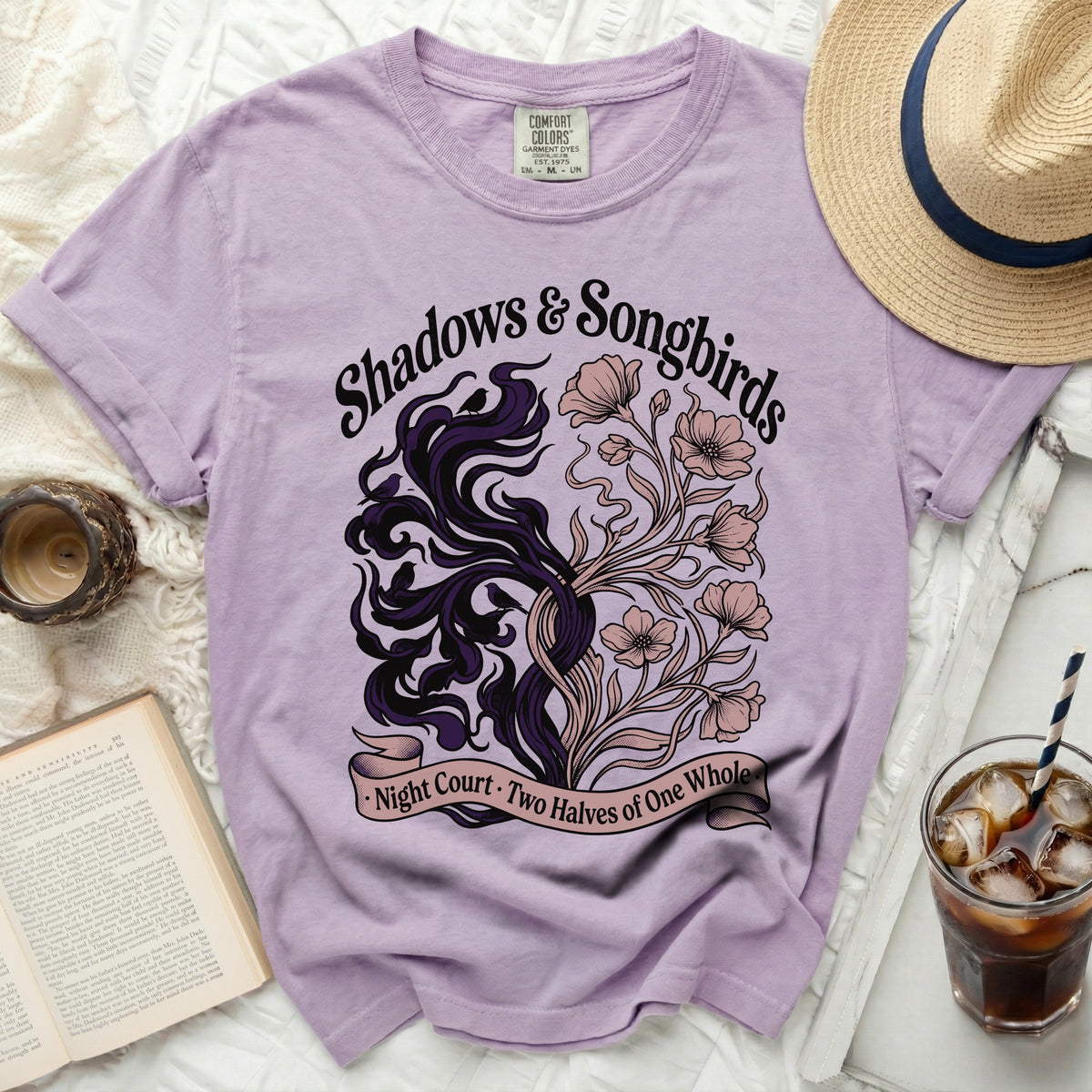 Purple t-shirt with "Shadows & Songbirds" and nature graphic.