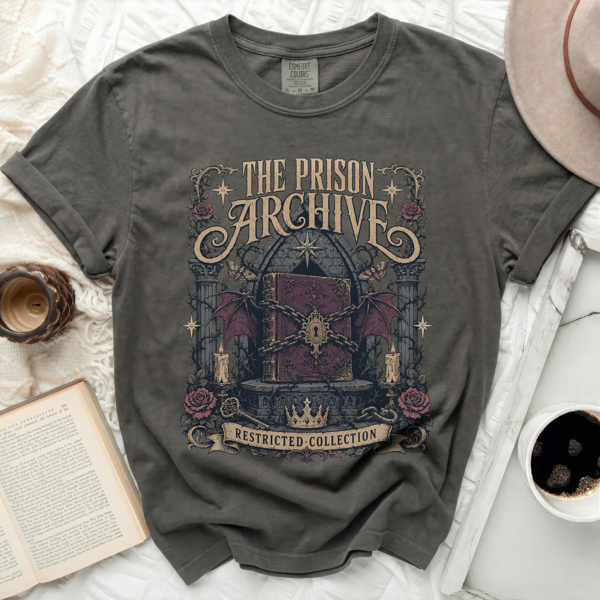 The Prison Archive Restricted Collection graphic on a dark grey t-shirt.