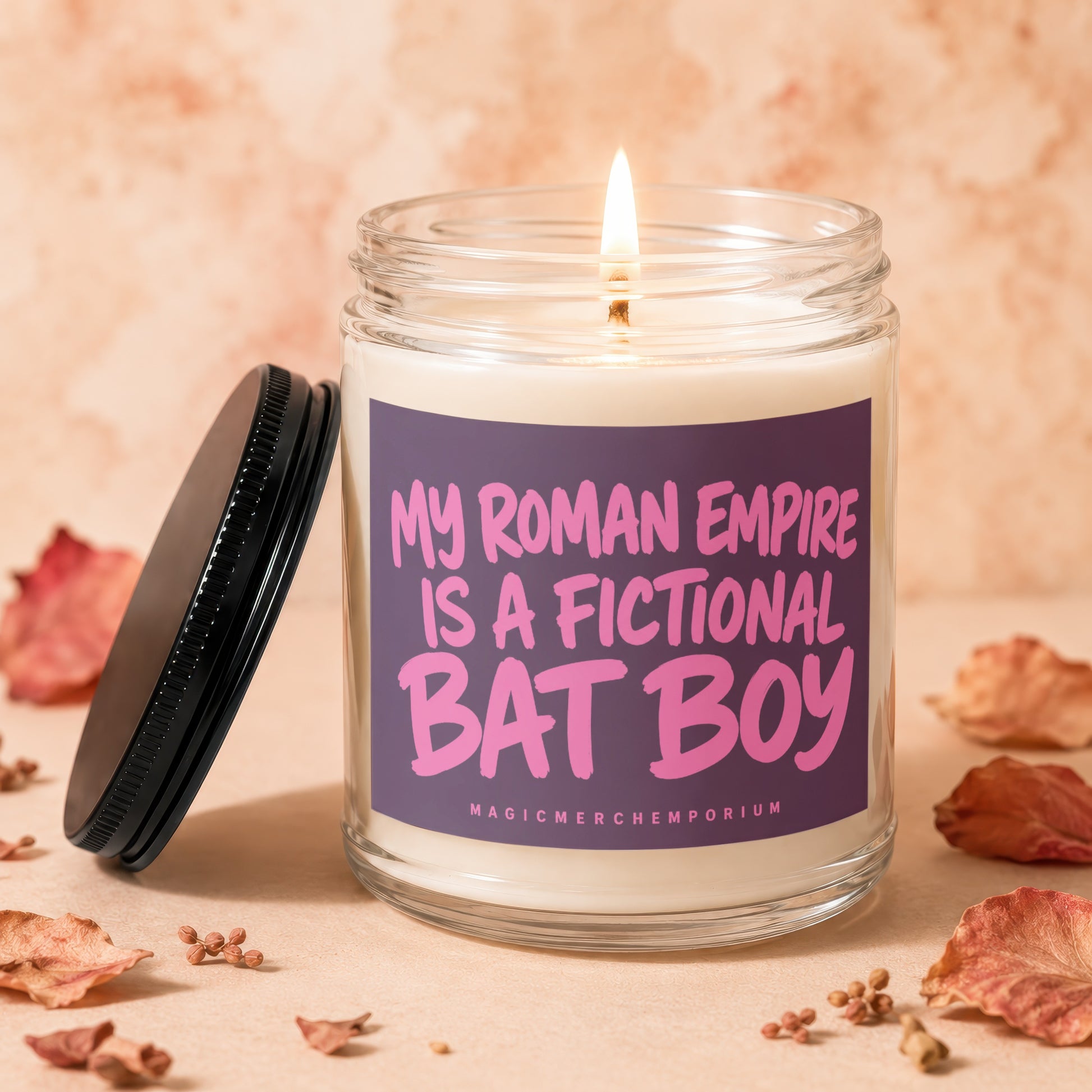 Candle with purple label that reads "My Roman Empire is a Fictional Bat Boy"