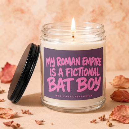 Candle with purple label that reads "My Roman Empire is a Fictional Bat Boy"