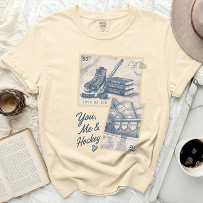Cream t-shirt with vintage hockey and book graphic and text.
